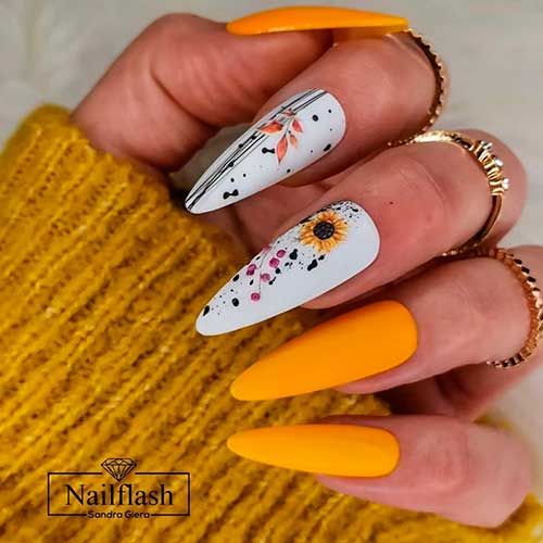 Autumn-matte-yellow-nails-2020-almond-shaped-with-two-accent-white-nails-adorned-with-sunflower-and-black-stripes.jpg